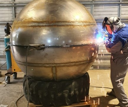 1.6metre diameter carbon steel sphere being cut for mould